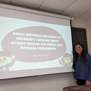 Photo of Keiana Price and her thesis title slide