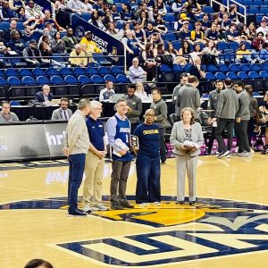 Dr. Marcovitch at center court being honored with SOCON faculty award