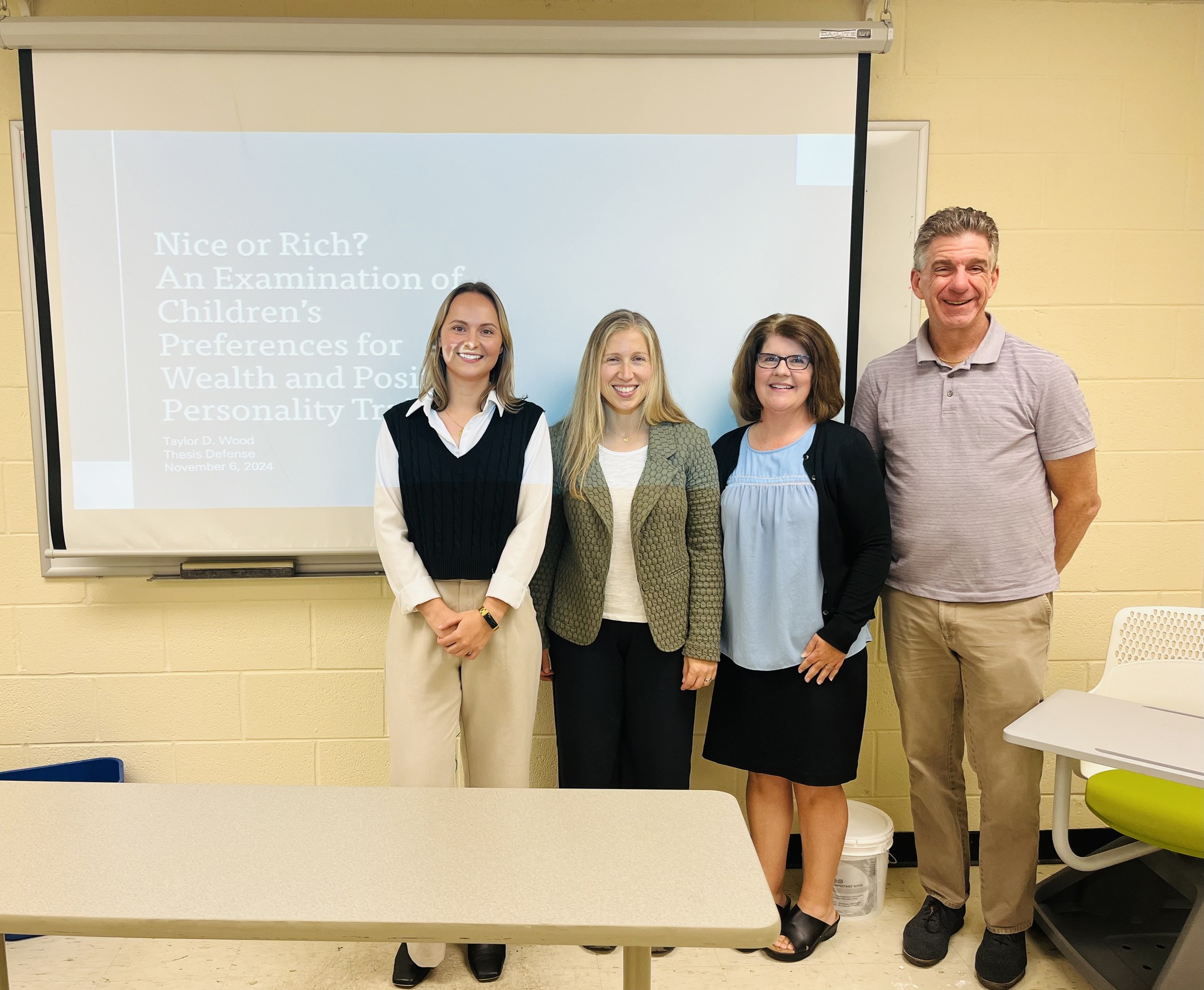 Taylor Wood after defending her thesis with her committee members