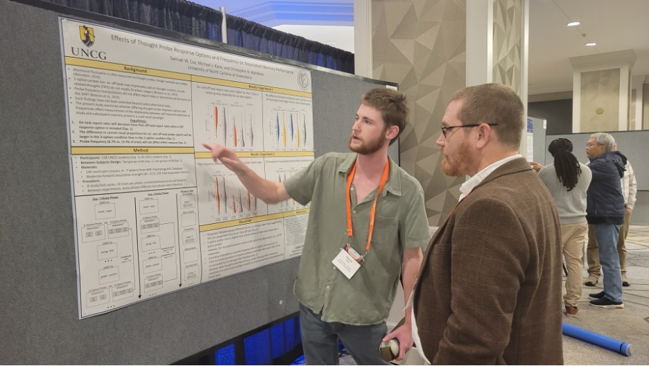 Samuel Cox presenting a poster.