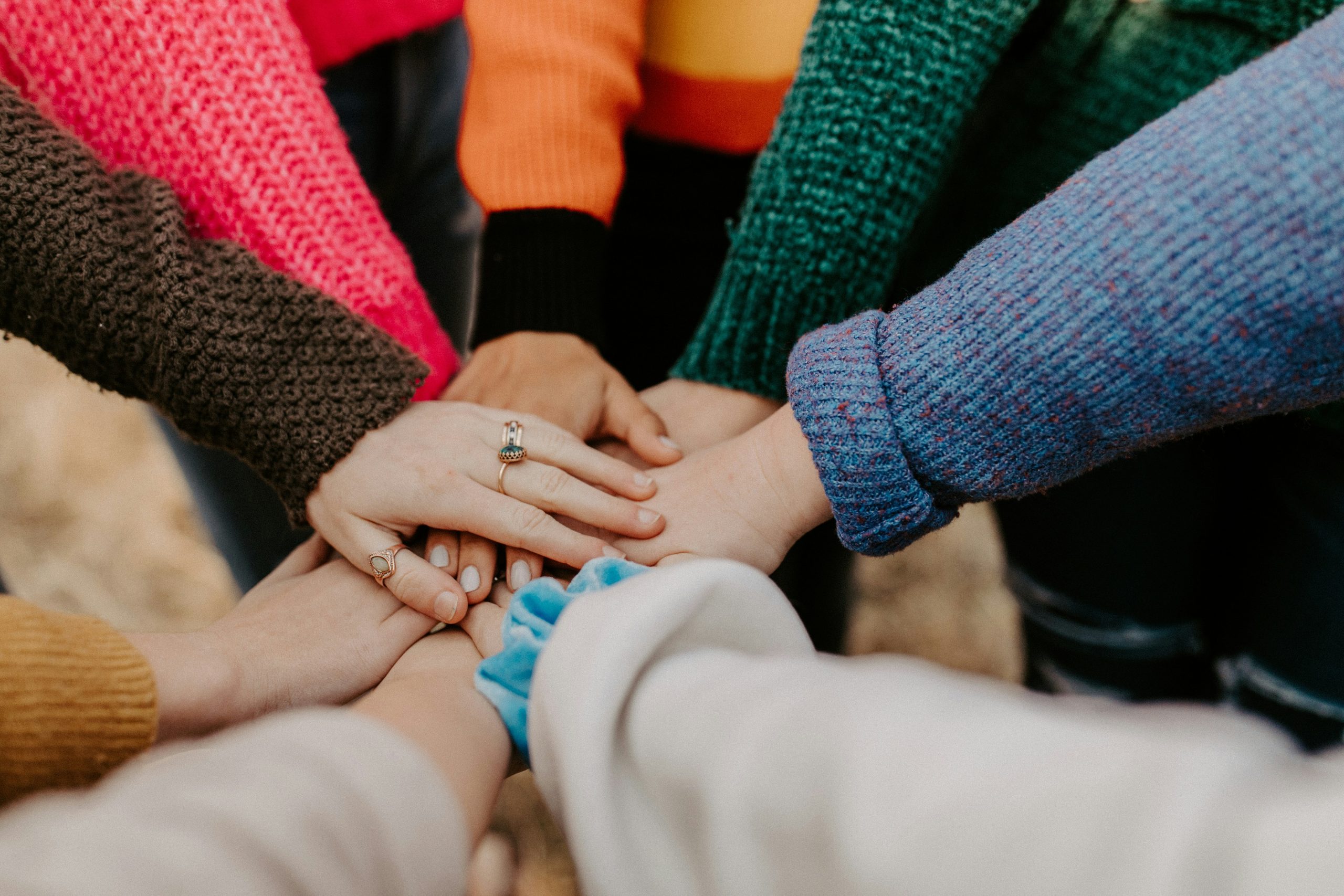 gathering of hands for group support